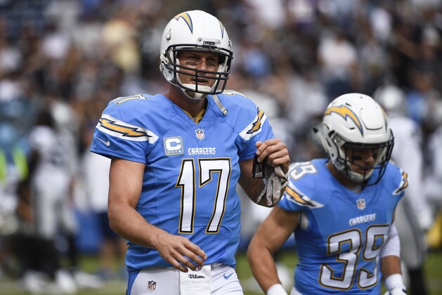 San Diego Chargers quarterback Philip Rivers walks off the field after an interception during the first half of an NFL football game against the Oakland Raiders Sunday, Oct. 25, 2015, in San Diego. (AP Photo/Denis Poroy)