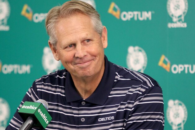 Danny Ainge, president of basketball operations, smiles as he listens to a question during the team's NBA basketball media day at their training facility in Waltham, Mass., Friday, Sept. 25, 2015. (AP Photo/Mary Schwalm)