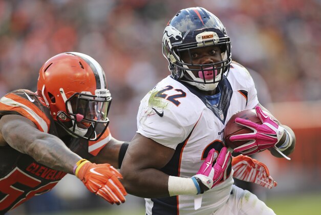 Cleveland Browns linebacker Chris Kirksey (58) tackles Denver Broncos running back C.J. Anderson (22) during the second half of an NFL football game Sunday, Oct. 18, 2015, in Cleveland. (AP Photo/Aaron Josefczyk)