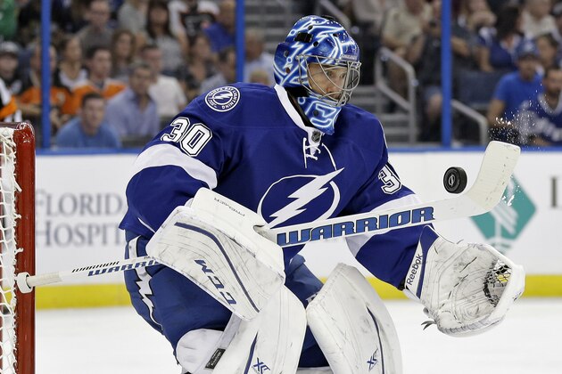 Tampa Bay Lightning goalie Ben Bishop (30) makes a save on a shot by Philadelphia Flyers during the first period of an NHL hockey game Thursday, Oct. 8, 2015, in Tampa, Fla. (AP Photo/Chris O'Meara)