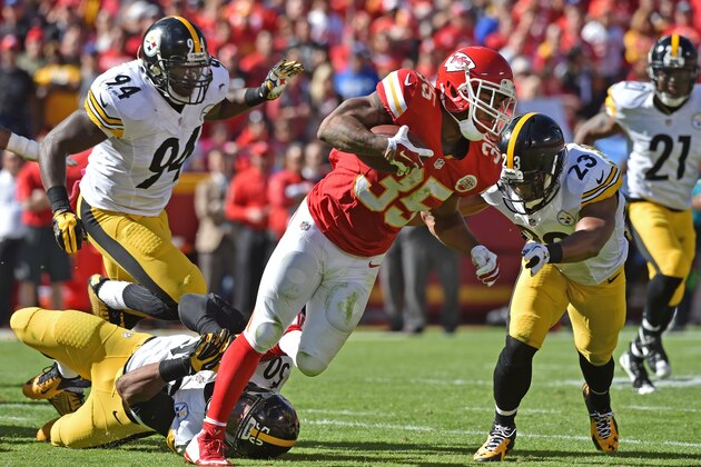 KANSAS CITY, MO - OCTOBER 25:  Defenders Mike Mitchell #23 and Ryan Shazier #50 of the Pittsburgh Steelers tackle running back Charcandrick West #35 of the Kansas City Chiefs during the second half on October 25, 2015 at Arrowhead Stadium in Kansas City, Missouri.  (Photo by Peter G. Aiken/Getty Images)