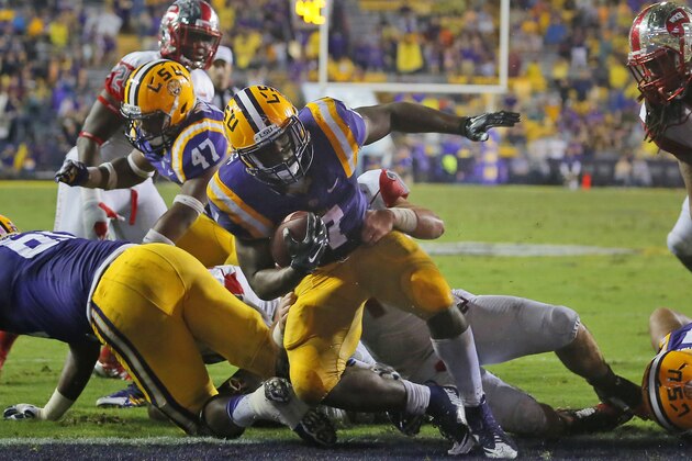 FILE - In this Oct. 24, 2015, file photo, LSU running back Leonard Fournette (7) scores a touchdown during the second half an NCAA college football game against Western Kentucky in Baton Rouge, La. Heisman Trophy hopeful Leonard Fournette and the Tigers have the week off before beginning a closing stretch against Alabama, Arkansas, Mississippi and Texas A&M. (AP Photo/Jonathan Bachman, File)