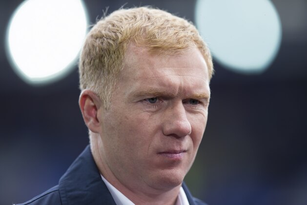 Paul Scholes as a television pundit before the English Premier League soccer match between Everton and Chelsea at Goodison Park Stadium, Liverpool, England, Saturday Sept. 12, 2015. (AP Photo/Jon Super)