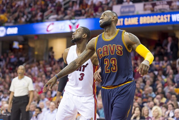CLEVELAND, OH - APRIL 2: Dwyane Wade #3 of the Miami Heat lines up for a foul shot with LeBron James #23 of the Cleveland Cavaliers during the first half at Quicken Loans Arena on April 2, 2015 in Cleveland, Ohio. NOTE TO USER: User expressly acknowledges and agrees that, by downloading and or using this photograph, User is consenting to the terms and conditions of the Getty Images License Agreement. (Photo by Jason Miller/Getty Images)