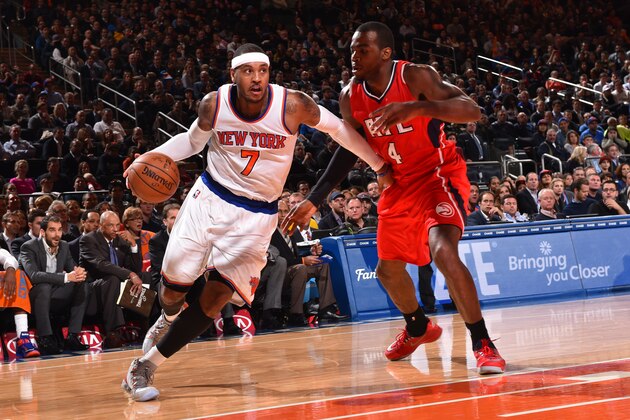 NEW YORK, NY - NOVEMBER 10:  Carmelo Anthony #7 of the New York Knicks drives to the basket against Paul Millsap #4 of the Atlanta Hawks on November 10, 2014 at Madison Square Garden in New York City.  NOTE TO USER: User expressly acknowledges and agrees that, by downloading and or using this Photograph, user is consenting to the terms and conditions of the Getty Images License Agreement. Mandatory Copyright Notice: Copyright 2014 NBAE (Photo by Jesse D. Garrabrant/NBAE via Getty Images)