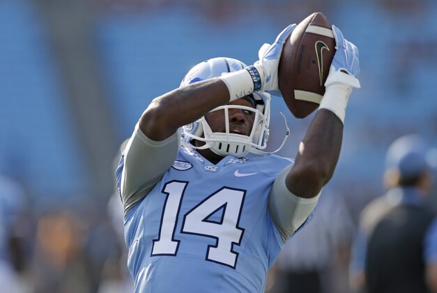 North Carolina's Quinshad Davis (14) warms up before an NCAA college football game against South Carolina in Charlotte, N.C., Thursday, Sept. 3, 2015. (AP Photo/Chuck Burton)