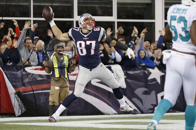 New England Patriots tight end Rob Gronkowski (87) celebrates his touchdown in the first half an NFL football game against the Miami Dolphins, Thursday, Oct. 29, 2015, in Foxborough, Mass. (AP Photo/Michael Dwyer)