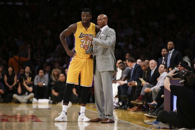 Los Angeles Lakers head coach Byron Scott, right, talks to Julius Randle during the first half of an NBA basketball game against the Minnesota Timberwolves, Wednesday, Oct. 28, 2015, in Los Angeles. (AP Photo/Jae C. Hong)