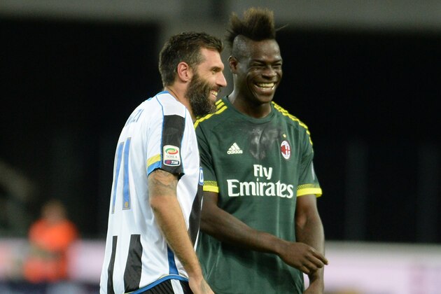 UDINE, ITALY - SEPTEMBER 22:  Maurizio Domizzi (L) of Udinese Calcio speakes  with Mario Balotelli of AC Milan during the Serie A match between Udinese Calcio and AC Milan at Stadio Friuli on September 22, 2015 in Udine, Italy.  (Photo by Dino Panato/Getty Images)