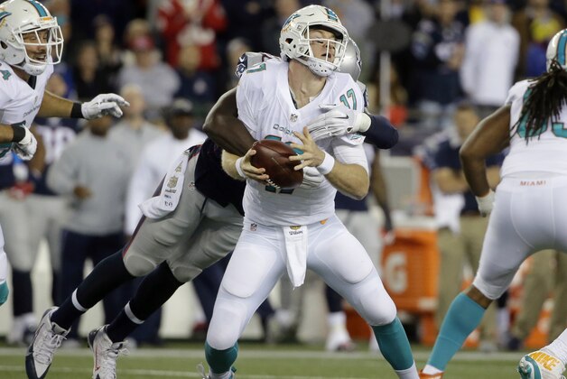 New England Patriots defensive end Chandler Jones (95) sacks Miami Dolphins quarterback Ryan Tannehill (17) in the first half an NFL football game, Thursday, Oct. 29, 2015, in Foxborough, Mass. (AP Photo/Steven Senne)