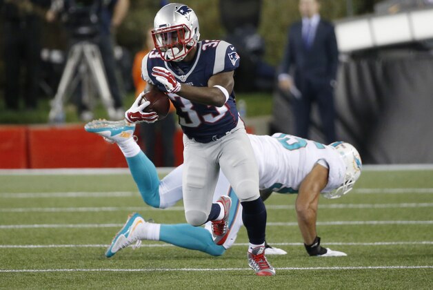 New England Patriots running back Dion Lewis (33) runs against the Miami Dolphins in the first half an NFL football game, Thursday, Oct. 29, 2015, in Foxborough, Mass. (AP Photo/Michael Dwyer)