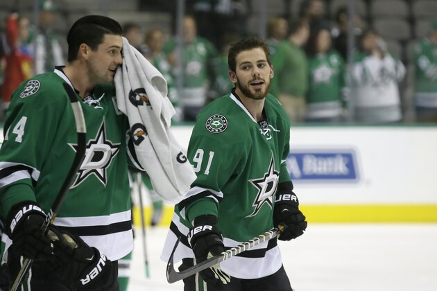 Dallas Stars left wing Jamie Benn (14) and  center Tyler Seguin (91) warm up before an NHL hockey game against the Vancouver Canucks Thursday, Oct. 29, 2015, in Dallas. (AP Photo/LM Otero)