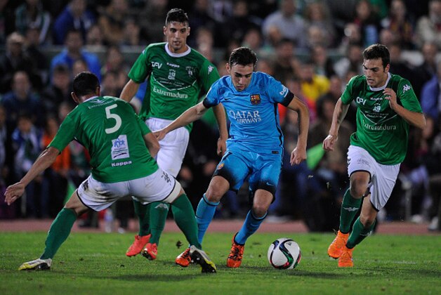 VILLANUEVA DE LA SERENA, SPAIN - OCTOBER 28:  Munir el Haddadi of FC Barcelona gets past Javi Sanchez of C.F. Villanovense during of the Copa del Rey Last of 16 First Leg match between C.F. Villanovense and F.C. Barcelona at estadio Romero Cuerda on October 28, 2015 in Villanueva de la Serena, Spain.  (Photo by Denis Doyle/Getty Images)
