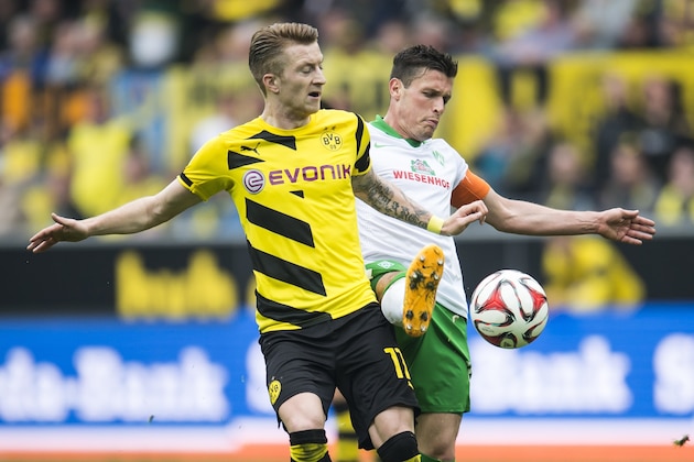 (L-R) Marco Reus of Borussia Dortmund, Zlatko Junuzoviv of Werder Bremen during the Bundesliga match between Borussia Dortmund and Werder Bremen on May 23, 2015 at the Signal Iduna Park in Dortmund, Germany.(Photo by VI Images via Getty Images)