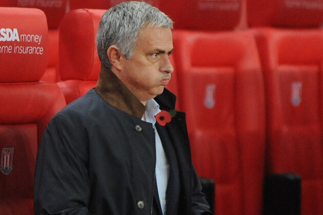 Chelsea manager Jose Mourinho in the dug out before the English League Cup Fourth Round soccer match between Stoke City and Chelsea at the Britannia Stadium, Stoke on Trent, England, Tuesday, Oct. 27, 2015. (AP Photo/Rui Vieira)