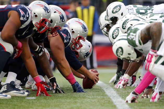 The New England Patriots and the New York Jets at the line of scrimmage for a snap during a NFL football game at Gillette Stadium in Foxborough, Mass. Sunday, Oct. 25, 2015. (Winslow Townson/AP Images for Panini)