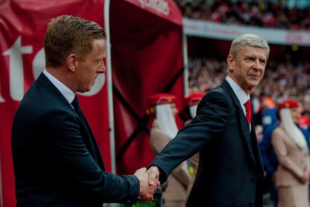 LONDON, ENGLAND - MAY 11: Manager of Swansea City, Garry Monk shakes hands with Manager of Arsenal, Arsene Wenger prior to the  the Premier League match between Arsenal and Swansea City at Emirates Stadium on May 11, 2015 in London, England.  (Photo by Athena Pictures/Getty Images)