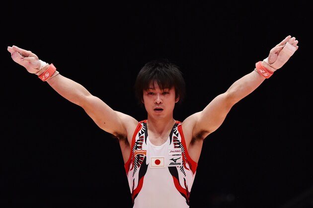 Japan's Kohei Uchimura lands after performing on the rings during the Men's All-Around final during the 2015 World Gymnastics Championship in Glasgow, Scotland, on October 30, 2015. Gymnasts can secure qualification for the 2016 Rio Games at the championships which are being staged at the Hydro Arena.  AFP PHOTO / BEN STANSALL        (Photo credit should read BEN STANSALL/AFP/Getty Images)