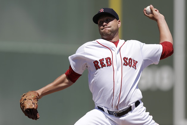 Boston Red Sox's starting pitcher Brian Johnson delivers against the Tampa Bay Rays in the first inning during an exhibition spring training baseball game, Sunday, March 29, 2015, in Fort Myers, Fla. (AP Photo/Brynn Anderson)