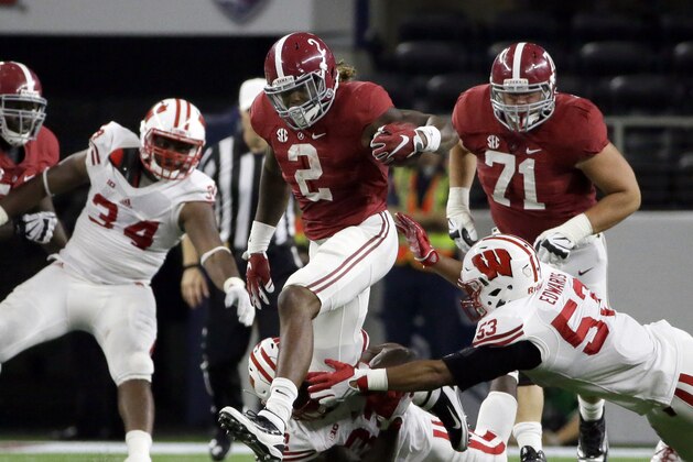 Alabama running back Derrick Henry (2) carries against Wisconsin defenders T.J. Edwards (53) and Leon Jacobs, bottom, during the first half of an NCAA college football game Saturday, Sept. 5, 2015, in Arlington, Texas. (AP Photo/LM Otero)