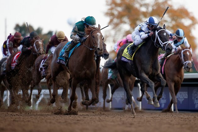 LEXINGTON, KY - OCTOBER 30:  Javier Castellano rides Stopchargingmaria #4 to edge out Stellar Wind #9 with by Victor Espinoza up to win the Breeder's Cup Distaff at Keeneland Racecourse on October 30, 2015 in Lexington, Kentucky.  (Photo by Rob Carr/Getty Images)