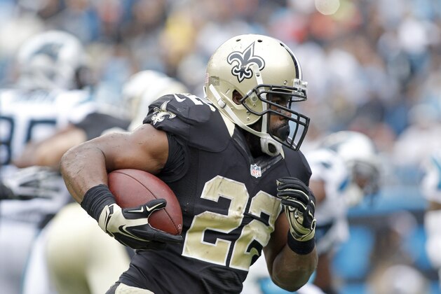 New Orleans Saints' Mark Ingram (22) looks to turn the corner against the Carolina panthers' defense during the first half of an NFL football game in Charlotte, N.C., Sunday, Sept. 27, 2015. The Panthers won 27-22. (AP Photo/Bob Leverone)