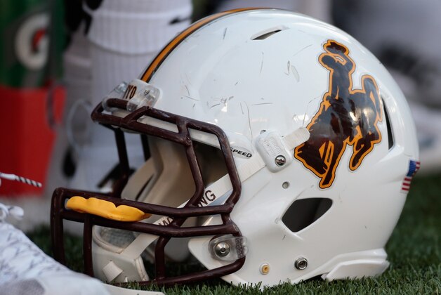 PULLMAN, WA - SEPTEMBER 19:  A Wyoming Cowboys football helmet sits on the field during the game against the Washington State Cougars at Martin Stadium on September 19, 2015 in Pullman, Washington.  (Photo by William Mancebo/Getty Images)