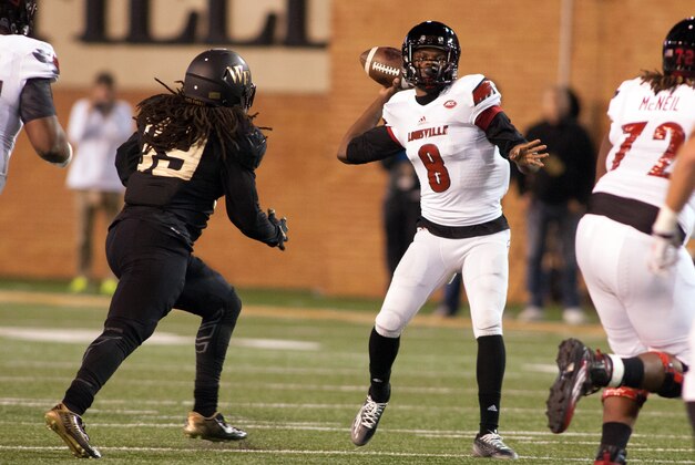 Oct 30, 2015; Winston-Salem, NC, USA; Louisville Cardinals quarterback Lamar Jackson (8) looks to pass while Wake Forest Demon Deacons linebacker Jaboree Williams (39) applies pressure during the second quarter at BB&T Field. Mandatory Credit: Jeremy Brevard-USA TODAY Sports