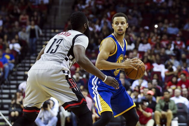 Oct 30, 2015; Houston, TX, USA; Golden State Warriors guard Stephen Curry (30) controls the ball during the first quarter as Houston Rockets guard James Harden (13) defends at Toyota Center. Mandatory Credit: Troy Taormina-USA TODAY Sports