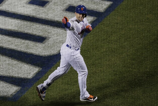 New York Mets' David Wright celebrates his two-run home run during the first inning of Game 3 of the Major League Baseball World Series against the Kansas City Royals Friday, Oct. 30, 2015, in New York. (AP Photo/Peter Morgan)