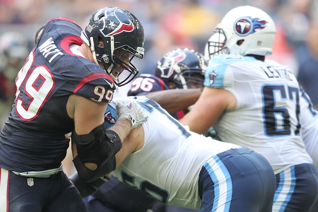 HOUSTON, TX - NOVEMBER 30: J.J. Watt #99 of the Houston Texans moves around the Tennessee Titans offensive line in a NFL game on November 30, 2014 at NRG Stadium in Houston, Texas. (Photo by Thomas B. Shea/Getty Images)