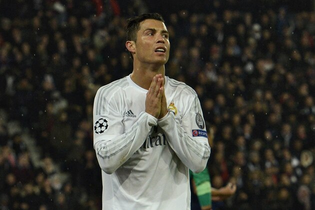 Real Madrid's Portuguese forward Cristiano Ronaldo reacts after missing a goal opportunity during the UEFA Champions League football match Paris Saint-Germain (PSG) vs Real Madrid, on October 21, 2015 at the Parc des Princes stadium in Paris.   AFP PHOTO / MIGUEL MEDINA        (Photo credit should read MIGUEL MEDINA/AFP/Getty Images)