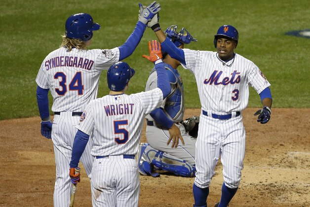 New York Mets' Curtis Granderson celebrates after hitting a two-run home run during the third inning of Game 3 of the Major League Baseball World Series against the Kansas City Royals Friday, Oct. 30, 2015, in New York. (AP Photo/Frank Franklin II)