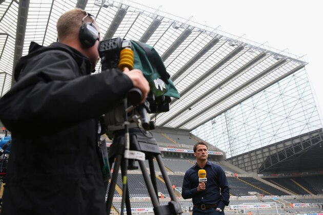 NEWCASTLE UPON TYNE, ENGLAND - OCTOBER 19:  BT Sport football presenter, Michael Owen looks on ahead of the Barclays Premier League match between Newcastle United and Liverpool at St James' Park on October 19, 2013 in Newcastle upon Tyne, England.  (Photo by Julian Finney/Getty Images)
