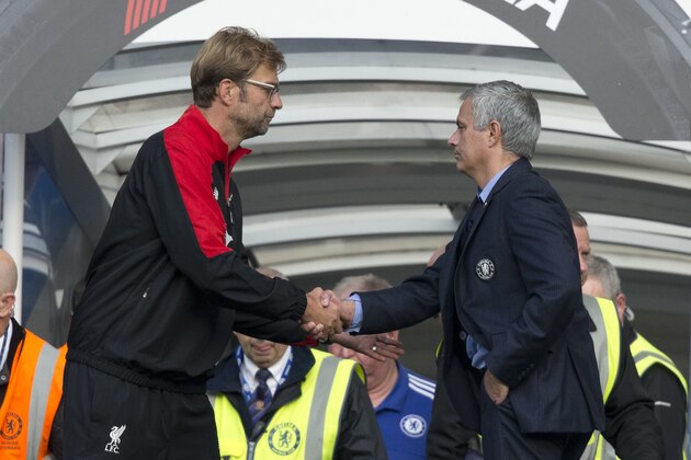 Chelsea's head coach Jose Mourinho, right, shakes hands with Liverpool's head coach Juergen Klopp after the final whistle of the English Premier League soccer match between Chelsea and Liverpool at Stamford Bridge stadium in London, Saturday, Oct. 31, 2015. Chelsea lost the match 3-1. (AP Photo/Matt Dunham)