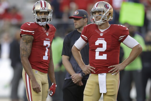 San Francisco 49ers quarterback Colin Kaepernick (7) and quarterback Blaine Gabbert (2) warm up before an NFL football game against the Seattle Seahawks in Santa Clara, Calif., Thursday, Oct. 22, 2015. (AP Photo/Ben Margot)