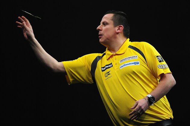 EXETER, ENGLAND - MARCH 05:  Dave Chisnall of England competes against Gary Anderson of Scotland during The Betway Premier League Darts at Westpoint Arena on March 5, 2015 in Exeter, England.  (Photo by Dan Mullan/Getty Images)