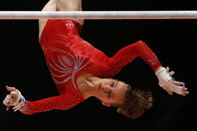 United States' Madison Kocian performs during her uneven bars exercise in the women's team final competition at the World Artistic Gymnastics championships at the SSE Hydro Arena in Glasgow, Scotland, Tuesday, Oct. 27, 2015. (AP Photo/Matthias Schrader)