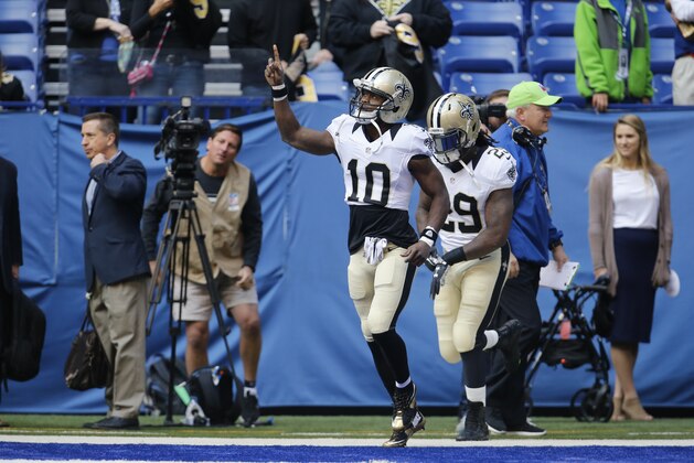 New Orleans Saints wide receiver Brandin Cooks (10) and running back Khiry Robinson (29) take the field before an NFL football game against the Indianapolis Colts in Indianapolis, Sunday, Oct. 25, 2015. (AP Photo/AJ Mast)