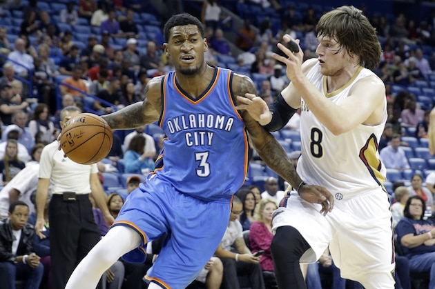 Oklahoma City Thunder forward Perry Jones (3) drives to the basket against New Orleans Pelicans forward Luke Babbitt (8) in the first half of an NBA preseason basketball game in New Orleans, Thursday, Oct. 16, 2014. (AP Photo/Gerald Herbert)