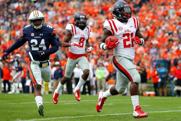 AUBURN, AL - OCTOBER 31:  Akeem Judd #21 of the Mississippi Rebels rushes in for a touchdown against Derrick Moncrief #24 of the Auburn Tigers at Jordan-Hare Stadium on October 31, 2015 in Auburn, Alabama.  (Photo by Kevin C. Cox/Getty Images)