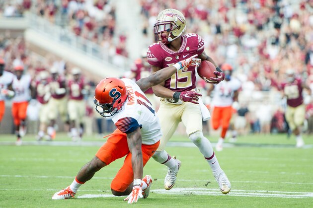 TALLAHASSEE, FL - OCTOBER 31: Wide receiver Travis Rudolph #15 of the Florida State Seminoles pushes cornerback Corey Winfield #11 of the Syracuse Orange while running the ball downfield on October 31, 2015 at Doak Campbell Stadium in Tallahassee, FL.  (Photo by Michael Chang/Getty Images)