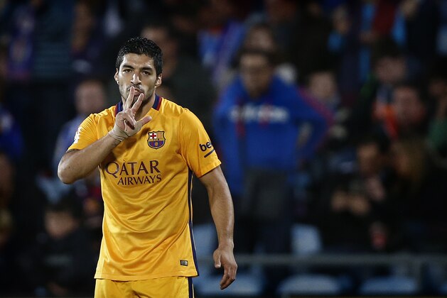 Barcelona's Luis Suarez celebrates after scoring a goal during a Spanish La Liga soccer match between Barcelona and Getafe at the Coliseum Alfonso Perez stadium in Getafe, Spain, Saturday, Oct. 31, 2015. (AP Photo/Daniel Ochoa de Olza)