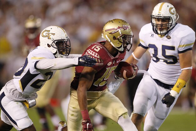 Oct 24, 2015; Atlanta, GA, USA; Florida State Seminoles wide receiver Travis Rudolph (15) is tackled by Georgia Tech Yellow Jackets defensive back Lawrence Austin (20) and linebacker Tyler Marcordes (35) in the second quarter at Bobby Dodd Stadium. Mandatory Credit: Brett Davis-USA TODAY Sports