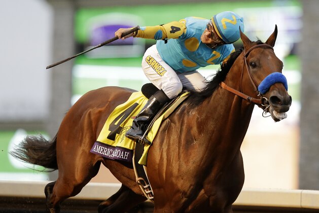 American Pharoah, with Victor Espinoza up, wins the Breeders' Cup Classic horse race at Keeneland race track Saturday, Oct. 31, 2015, in Lexington, Ky. (AP Photo/Mark Humphrey)