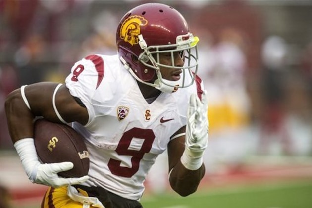 Southern California wide receiver JuJu Smith (9) runs upfield after catching a punt during warmups before the start of an NCAA college football game against Washington State on Saturday, Nov. 1, 2014, at Martin Stadium in Pullman, Wash. Southern California won 44-17. (AP Photo/Dean Hare)
