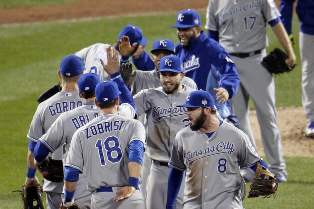 The Kansas City Royals celebrate their  win against the New York Mets in Game 4 of the Major League Baseball World Series Saturday, Oct. 31, 2015, in New York. The Royals won 5-3 to take a 3-1 lead in the series. (AP Photo/Charlie Riedel)
