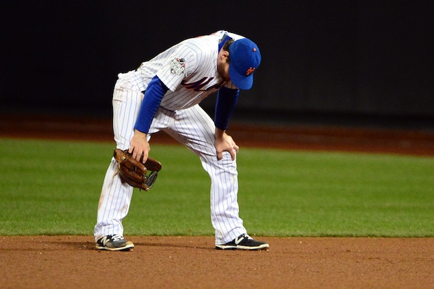 Oct 31, 2015; New York City, NY, USA; New York Mets second baseman Daniel Murphy (28) reacts after committing a fielding error in the 8th inning against the Kansas City Royals in game four of the World Series at Citi Field. Mandatory Credit: Jeff Curry-USA TODAY Sports
