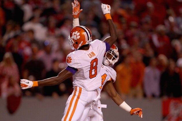 RALEIGH, NC - OCTOBER 31:  Teammates Ray-Ray McCloud #34 of the Clemson Tigers and Deon Cain #8 of the Clemson Tigers celebrate after McCloud makes a touchdown catch against the North Carolina State Wolfpack during their game at Carter-Finley Stadium on October 31, 2015 in Raleigh, North Carolina.  (Photo by Streeter Lecka/Getty Images)