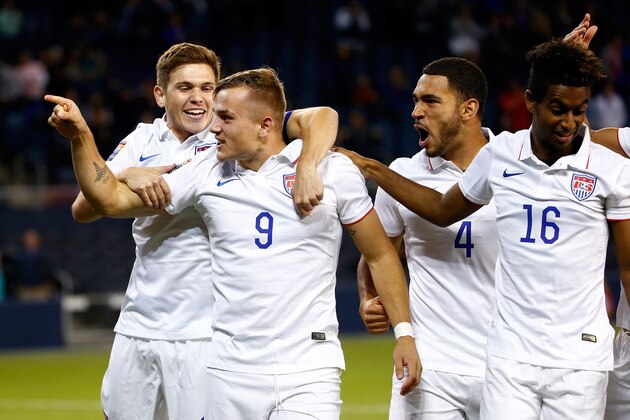 KANSAS CITY, KS - OCTOBER 01:  Jordan Morris #9 of the USA celebrates with teammates after scoring a goal during the 1st minute of the 2015 CONCACAF Olympic Qualifying match against Canada at Sporting Park on October 1, 2015 in Kansas City, Kansas.  (Photo by Jamie Squire/Getty Images)